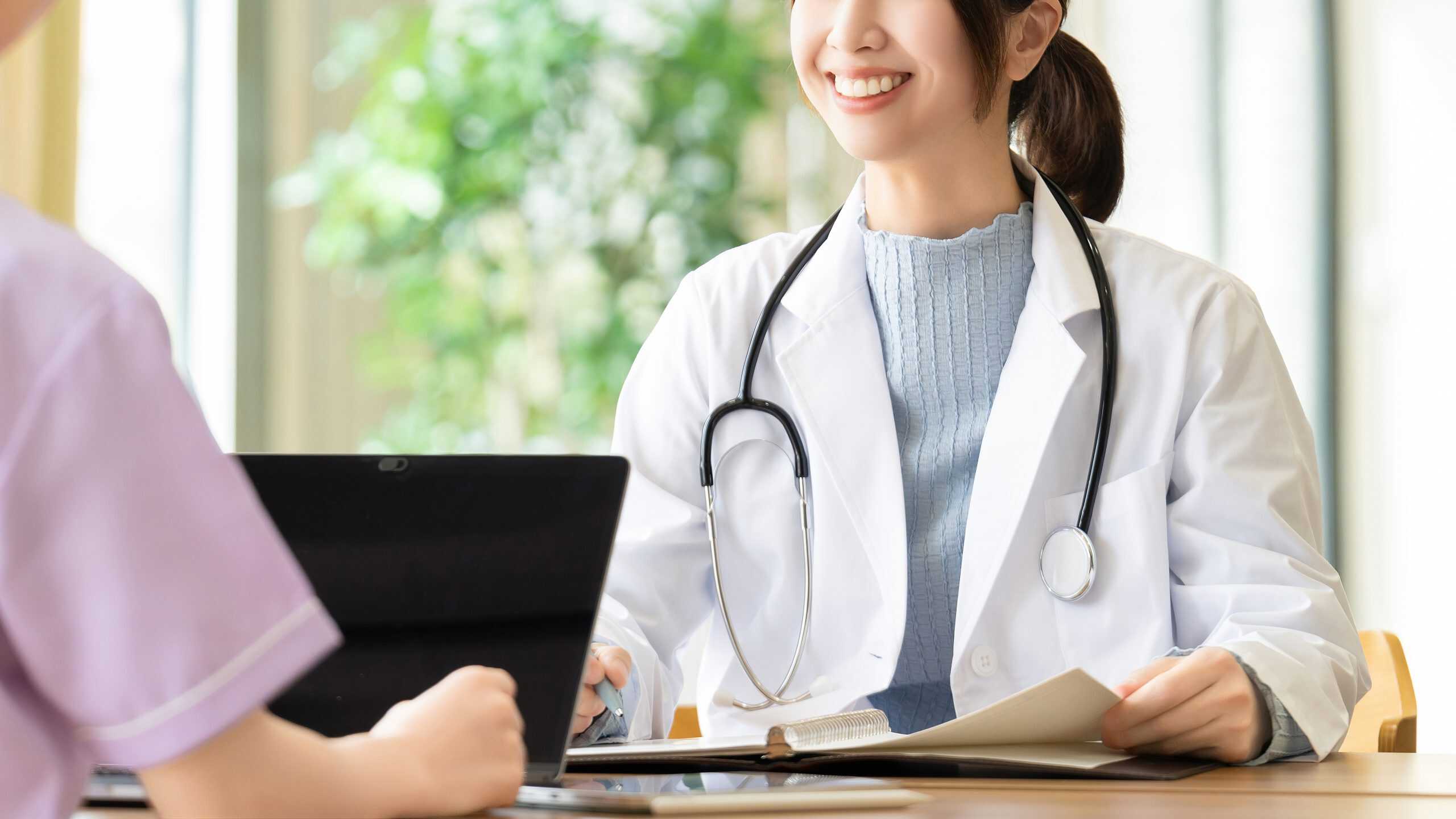 Medical consultation with a healthcare professional, doctor discussing health plan with patient, healthcare, medical advice, physician and patient interaction, health and wellness.